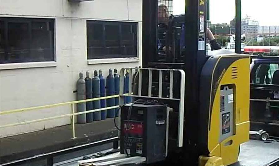 Forklift-loading-on-J-&-L-Towing-Flatbed-tow-truck-for-equipment-transport-in-Upper-Marlboro-Maryland Forklift loading on J & L Towing flatbed tow truck for equipment transport in Upper Marlboro Maryland