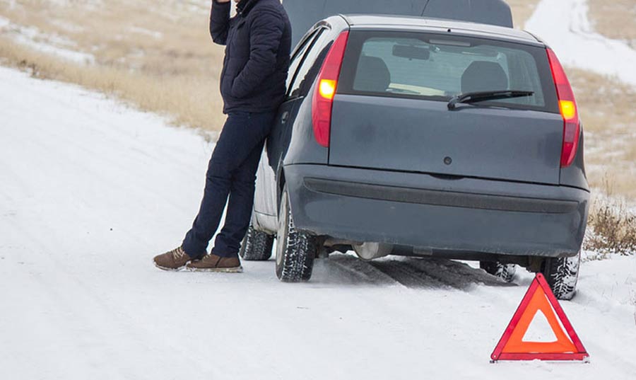 Man-on-phone-on-the-side-of-the-road-with-hood-on-his-car-up-emergency-triangle-in-Upper-Marlboro Man on phone on the side of the road with hood on his car up emergency triangle in Upper Marlboro Maryland