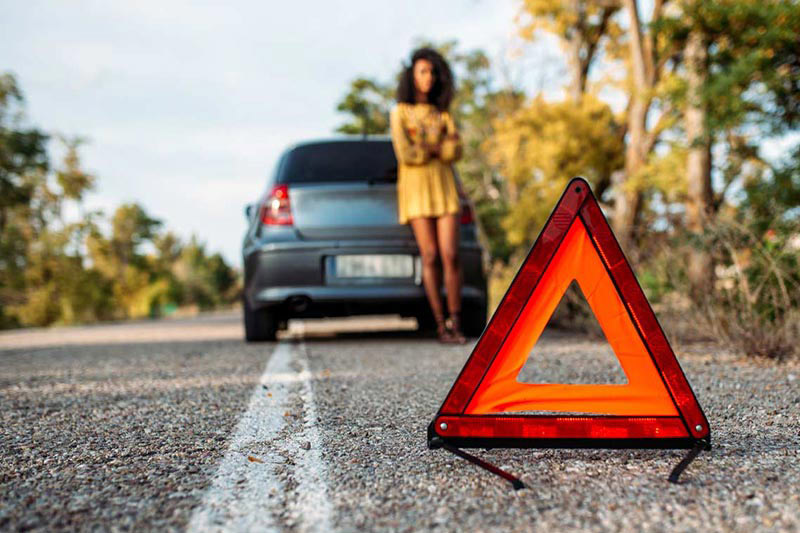 Woman-waiting-roadside-in-need-of-help-with-her-car-in-Upper-Marlboro-Maryland Woman waiting roadside with her car in need of help in Upper Marlboro Maryland